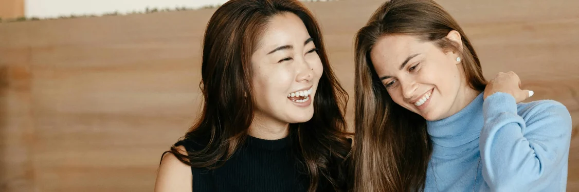 Two women smiling